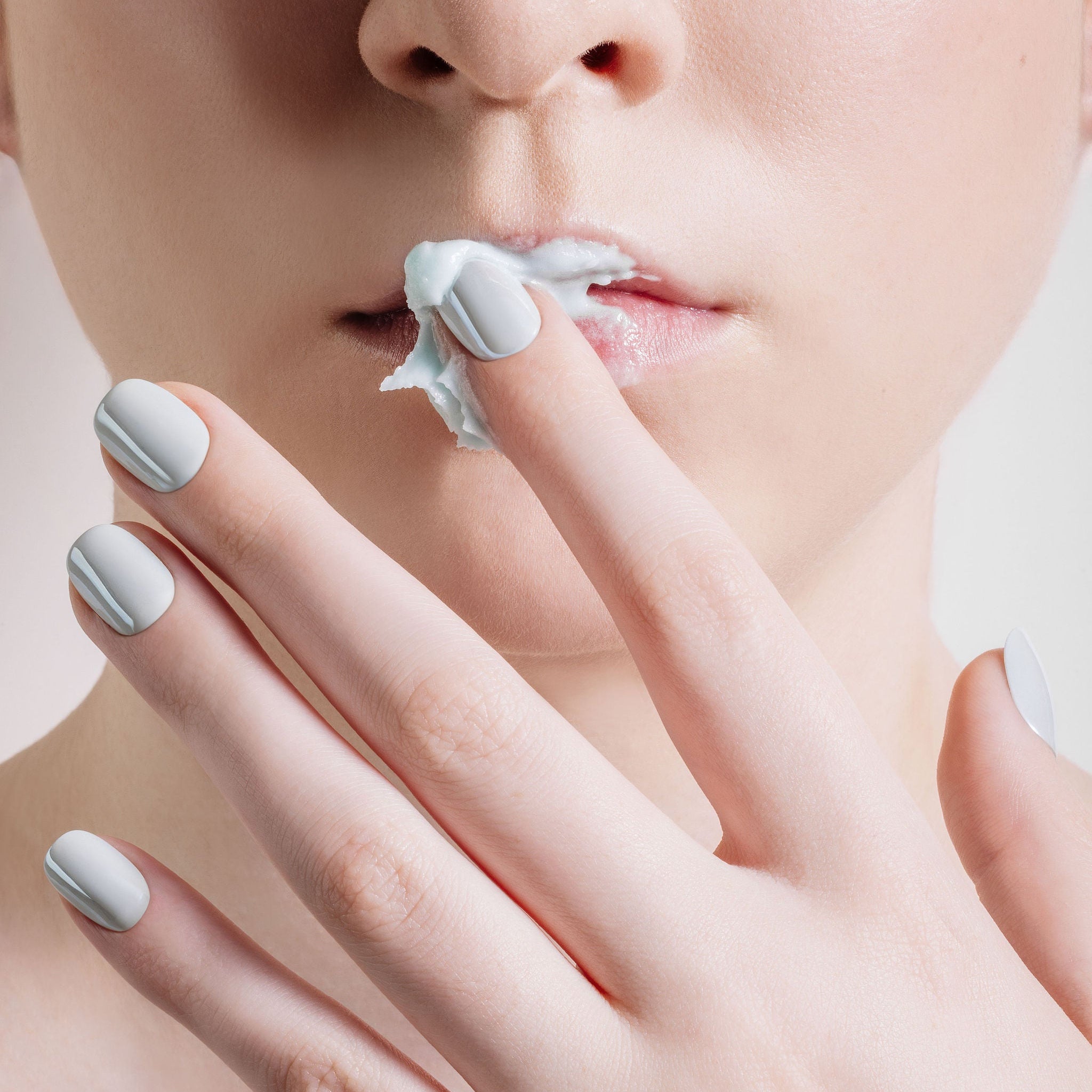 Glossy light blue nails with a fresh twist