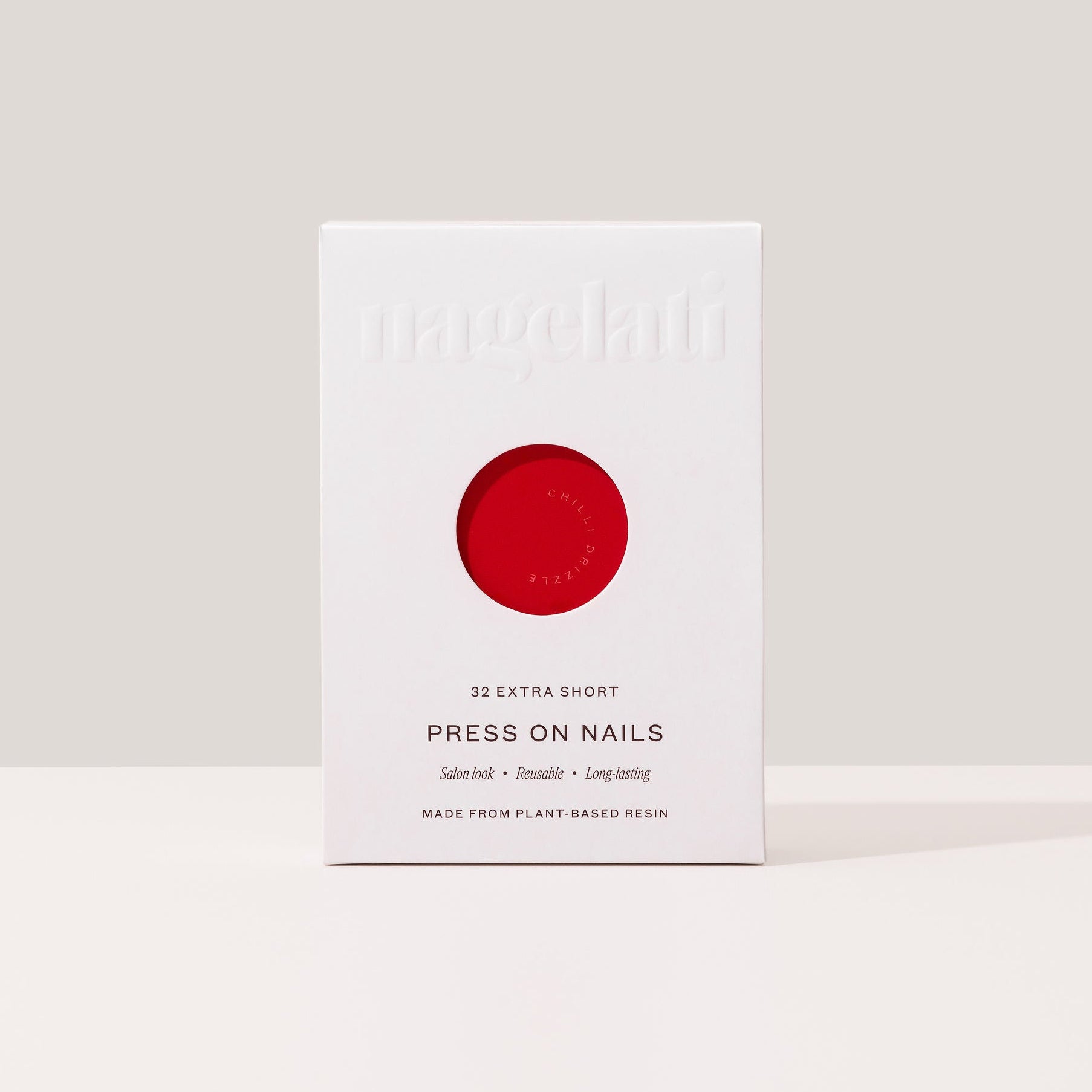 Press-on nails in plastic-free packaging made from FSC-certified paperboard.