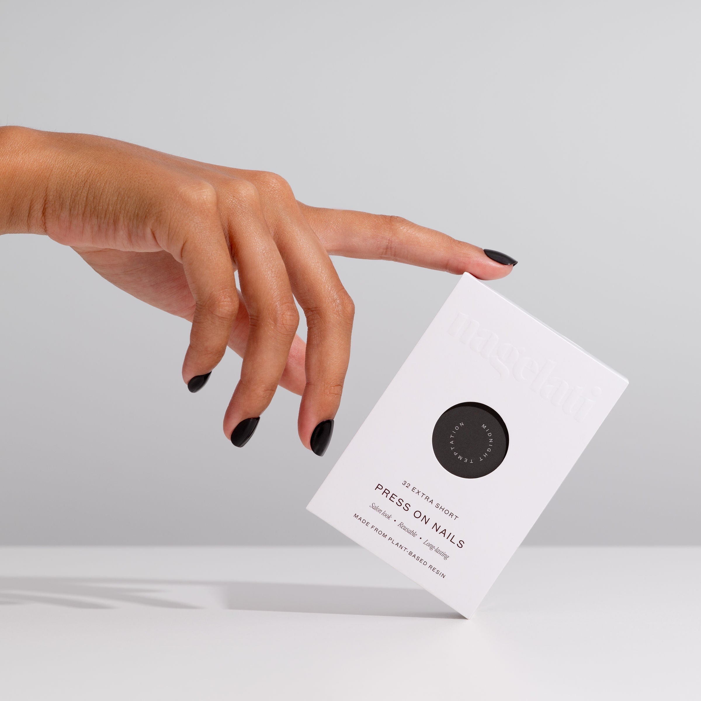 elegant black nails, press-on nails, done differently.